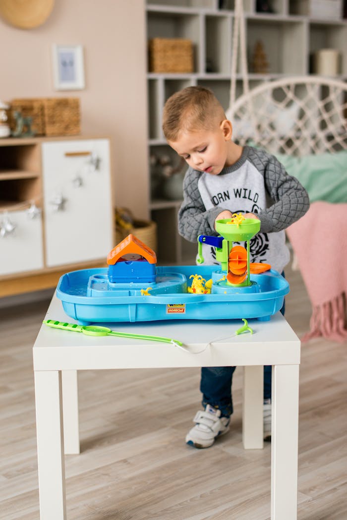 A child enjoying playtime with a plastic toy set in a cozy room, showcasing imaginative recreation.