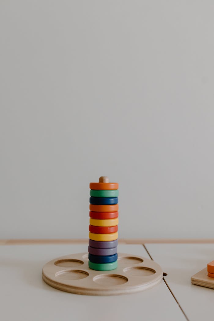 A colorful wooden stacking toy ready for imaginative play, enhancing children's motor skills.